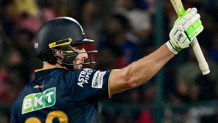 Gujarat Titans' Jos Buttler celebrates after scoring a half-century (50 runs) during the Indian Premier League (IPL) Twenty20 cricket match between Royal Challengers Bengaluru and Gujarat Titans at the M Chinnaswamy Stadium in Bengaluru on April 2, 2025. (Photo by AFP) / -- IMAGE RESTRICTED TO EDITORIAL USE - STRICTLY NO COMMERCIAL USE --